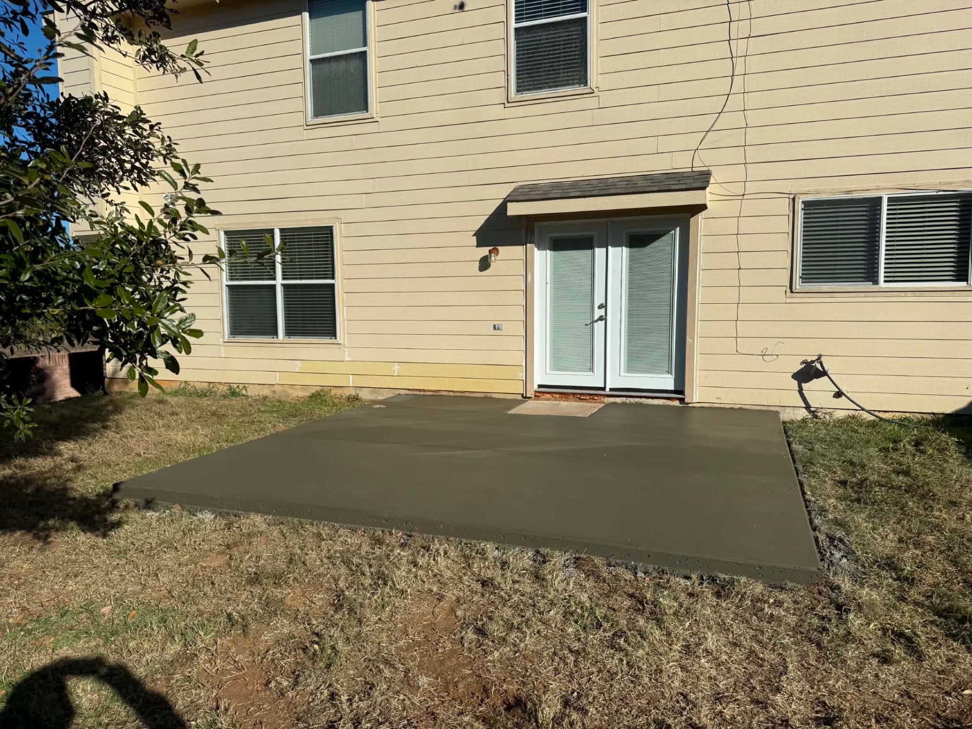 Back Door Patio Pad in Fort Worth, TX by Junior Concrete